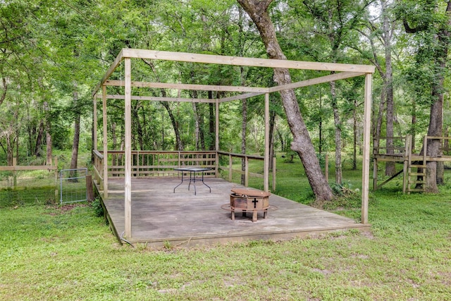 35 Disher Cir, Huffman, TX 77336 - view of yard featuring a fire pit and a wooden deck