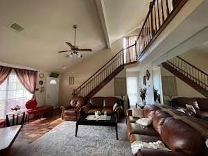 6706 Dinner Creek Ct, Katy, TX 77449 - living room with stairway, plenty of natural light, ceiling fan, and high vaulted ceiling