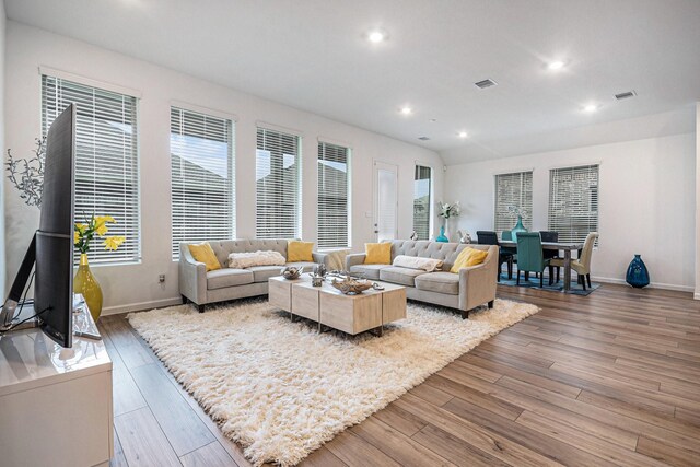 705 Western Fern, League City, TX 77573 - living area with wood-type flooring, baseboards, and recessed lighting