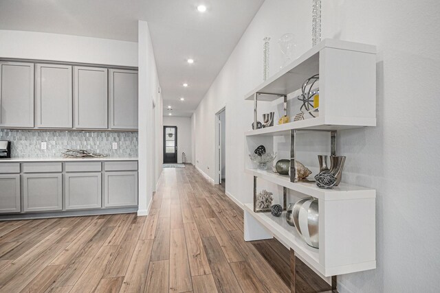 705 Western Fern, League City, TX 77573 - kitchen featuring gray cabinetry, open shelves, light wood-type flooring, recessed lighting, and light countertops
