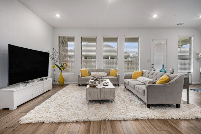 705 Western Fern, League City, TX 77573 - living area featuring recessed lighting, wood finished floors, and baseboards