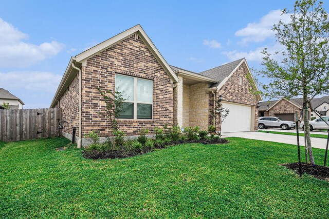 705 Western Fern, League City, TX 77573 - view of front facade with brick siding, driveway, and a garage