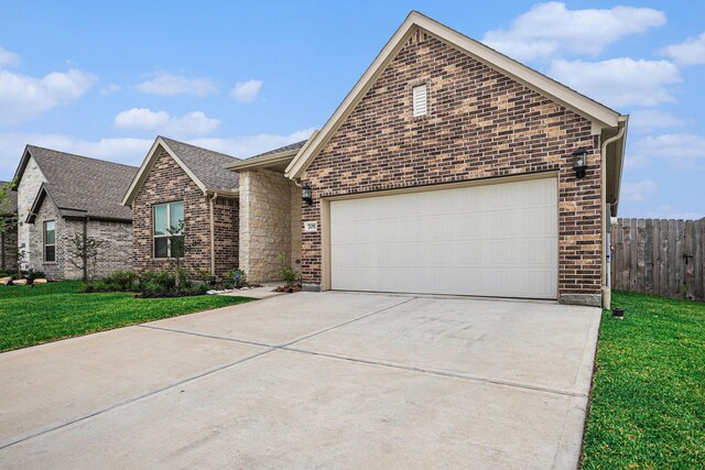 705 Western Fern, League City, TX 77573 - view of front of property featuring brick siding, concrete driveway, an attached garage, and roof with shingles