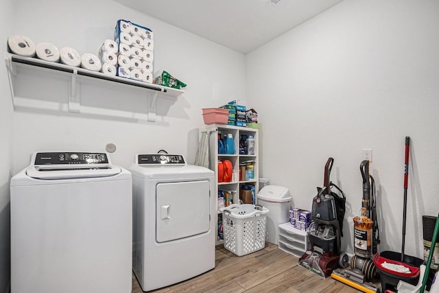 705 Western Fern, League City, TX 77573 - laundry room featuring washing machine and dryer and light wood finished floors
