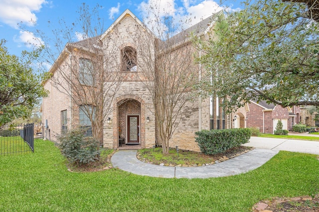 9710 Lansing Meadows Dr, Humble, TX 77396 - view of front facade featuring stone siding and concrete driveway
