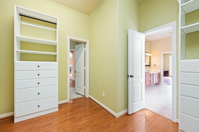 9710 Lansing Meadows Dr, Humble, TX 77396 - unfurnished bedroom with light wood-style floors and baseboards