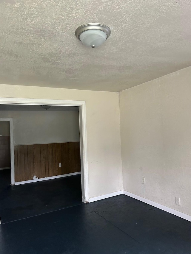 4412 Alvin St, Houston, TX 77051 - unfurnished room featuring concrete flooring, baseboards, and a textured ceiling