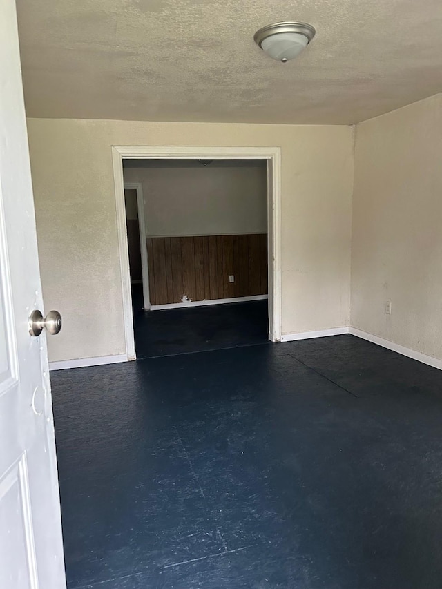 4412 Alvin St, Houston, TX 77051 - unfurnished room with concrete floors, baseboards, and a textured ceiling