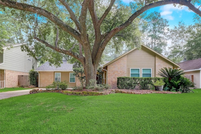 5218 Shady Gardens Dr, Houston, TX 77339 - view of front of property with brick siding and a front lawn