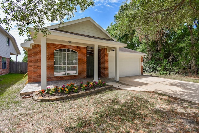 3219 Forest Willow Ln, Houston, TX 77068 - single story home featuring brick siding, a garage, covered porch, and driveway