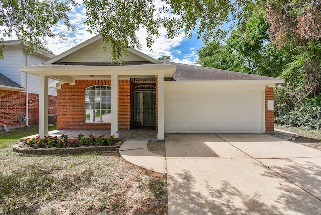 3219 Forest Willow Ln, Houston, TX 77068 - ranch-style home with brick siding, an attached garage, covered porch, driveway, and roof with shingles