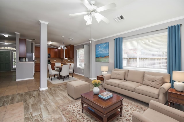 3219 Forest Willow Ln, Houston, TX 77068 - living room featuring ornamental molding, ceiling fan, a chandelier, baseboards, and light wood-style flooring