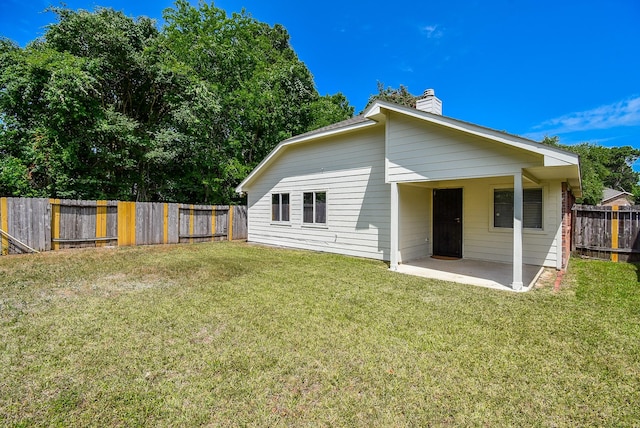 3219 Forest Willow Ln, Houston, TX 77068 - back of property featuring a patio and a chimney