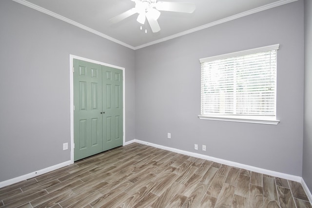 3219 Forest Willow Ln, Houston, TX 77068 - unfurnished bedroom featuring wood finished floors, baseboards, crown molding, a closet, and ceiling fan