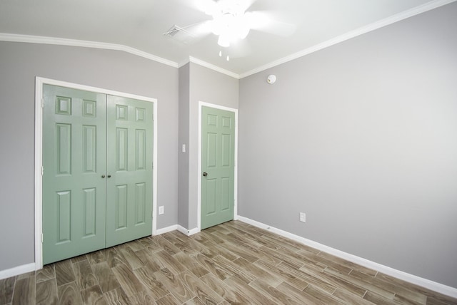 3219 Forest Willow Ln, Houston, TX 77068 - unfurnished bedroom with wood finished floors, baseboards, vaulted ceiling, a closet, and ornamental molding