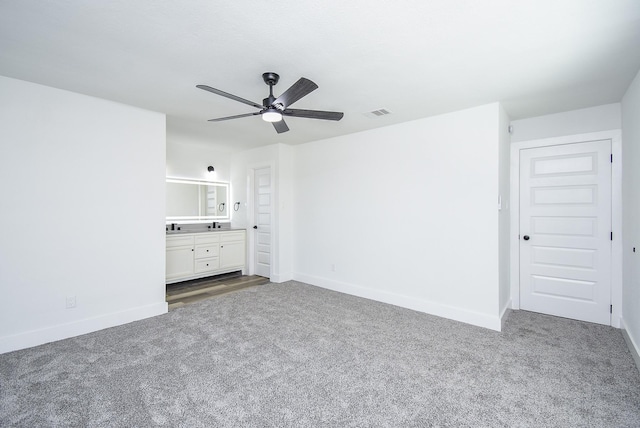 7418 Dew Mist Ln, Houston, TX 77095 - unfurnished bedroom featuring carpet floors, baseboards, and connected bathroom