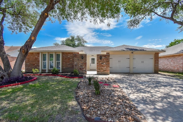 7418 Dew Mist Ln, Houston, TX 77095 - ranch-style house featuring brick siding, an attached garage, driveway, and a front lawn