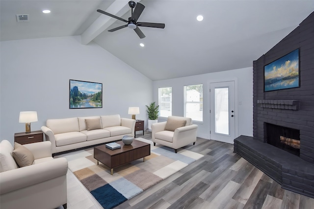 7418 Dew Mist Ln, Houston, TX 77095 - living area featuring a fireplace, wood finished floors, a ceiling fan, and recessed lighting