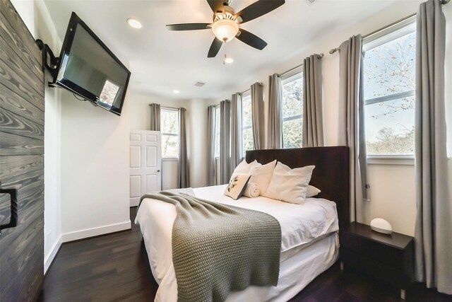 4530 Woodside St, Houston, TX 77023 - bedroom with dark wood-style floors, baseboards, recessed lighting, and a ceiling fan