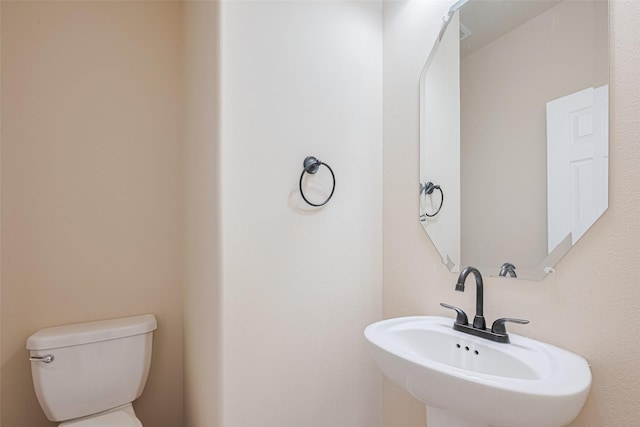 10015 Black Birch Ln, Tomball, TX 77375 - half bathroom with toilet and a sink