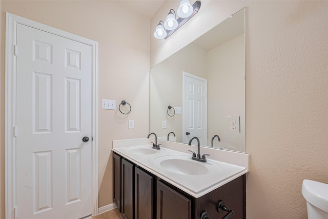 10015 Black Birch Ln, Tomball, TX 77375 - bathroom with double vanity and toilet