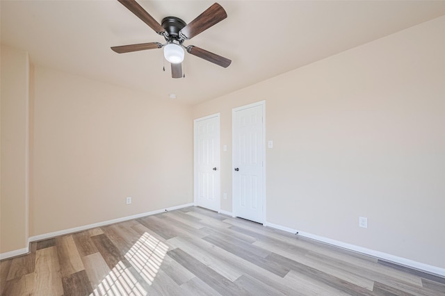 10015 Black Birch Ln, Tomball, TX 77375 - spare room featuring light wood-type flooring, baseboards, and ceiling fan