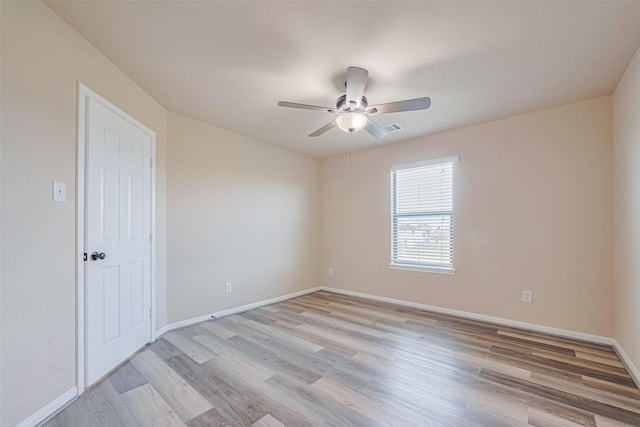 10015 Black Birch Ln, Tomball, TX 77375 - empty room featuring a ceiling fan, light wood finished floors, and baseboards