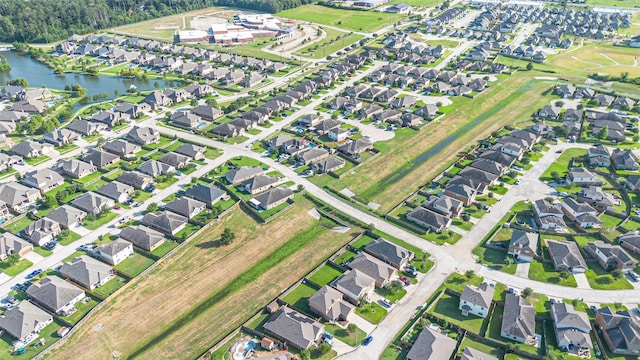 10015 Black Birch Ln, Tomball, TX 77375 - aerial view of property and surrounding area featuring a nearby body of water and nearby suburban area