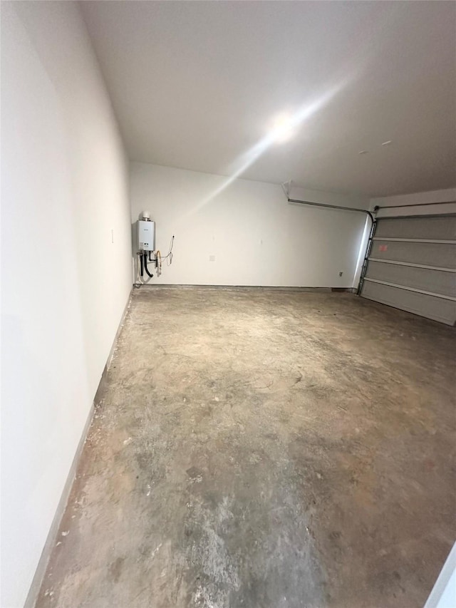 16477 Blossom Grove Dr, Conroe, TX 77303 - garage featuring tankless water heater
