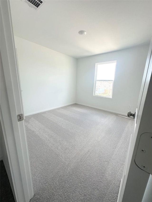 16477 Blossom Grove Dr, Conroe, TX 77303 - carpeted spare room with baseboards