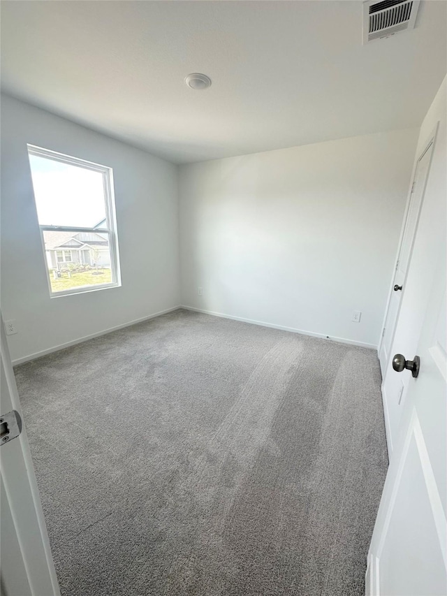 16477 Blossom Grove Dr, Conroe, TX 77303 - spare room with carpet floors and baseboards