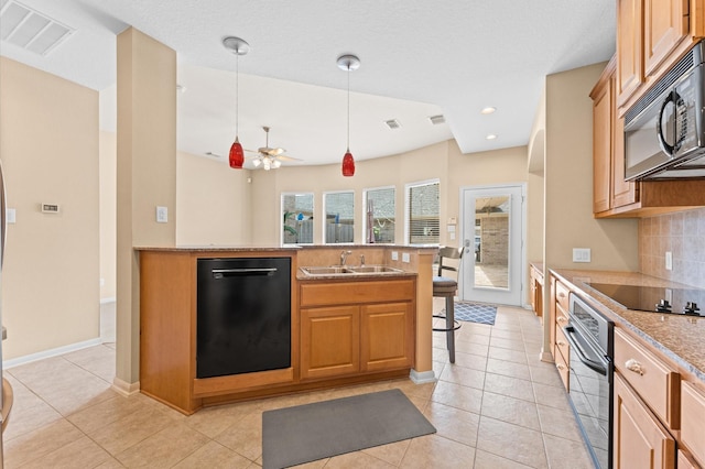 2411 Clippers Sq, Houston, TX 77058 - kitchen with black appliances, a sink, decorative backsplash, decorative light fixtures, and a ceiling fan