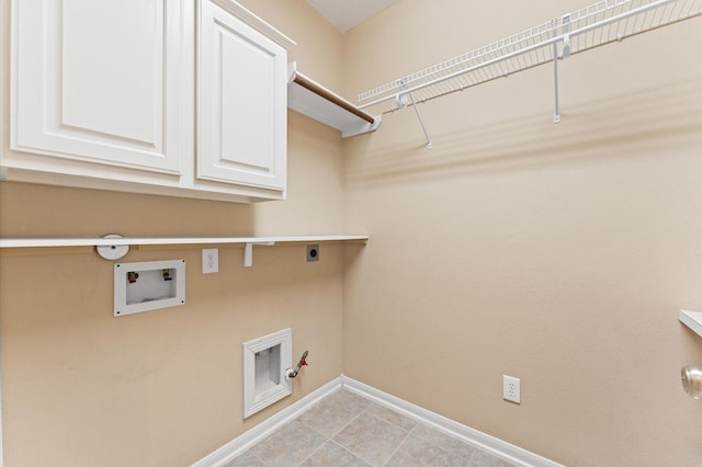 2411 Clippers Sq, Houston, TX 77058 - laundry area with hookup for a gas dryer, hookup for an electric dryer, hookup for a washing machine, baseboards, and cabinet space