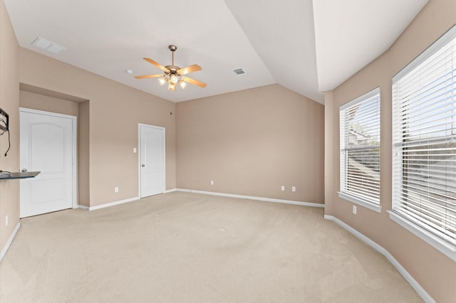 2411 Clippers Sq, Houston, TX 77058 - unfurnished bedroom featuring light carpet, baseboards, vaulted ceiling, and ceiling fan