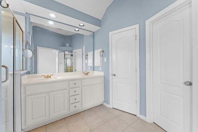 2411 Clippers Sq, Houston, TX 77058 - bathroom with a stall shower, double vanity, tile patterned floors, lofted ceiling, and baseboards