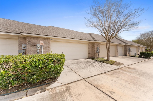 2411 Clippers Sq, Houston, TX 77058 - ranch-style home with brick siding, concrete driveway, and a garage