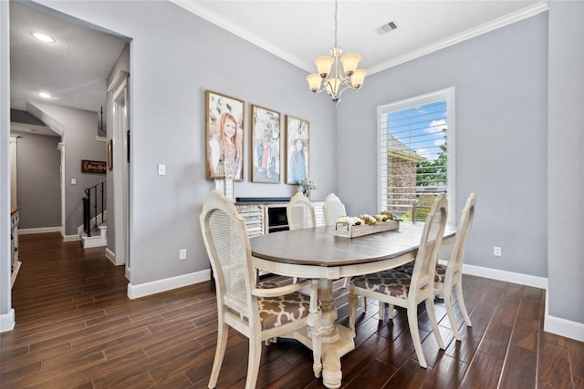 5219 Camp Creek Rd, Baytown, TX 77523 - dining room featuring baseboards, a chandelier, wood finished floors, crown molding, and stairway