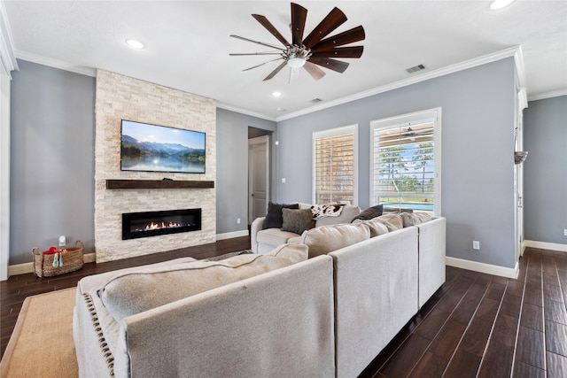 5219 Camp Creek Rd, Baytown, TX 77523 - living room featuring ceiling fan, dark wood finished floors, ornamental molding, baseboards, and a fireplace
