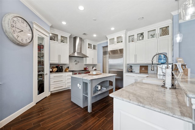 5219 Camp Creek Rd, Baytown, TX 77523 - kitchen featuring wall chimney range hood, stainless steel built in refrigerator, crown molding, open shelves, and tasteful backsplash