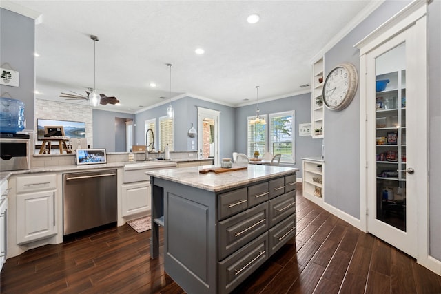 5219 Camp Creek Rd, Baytown, TX 77523 - kitchen featuring stainless steel dishwasher, a sink, gray cabinets, dark wood-style floors, and white cabinets