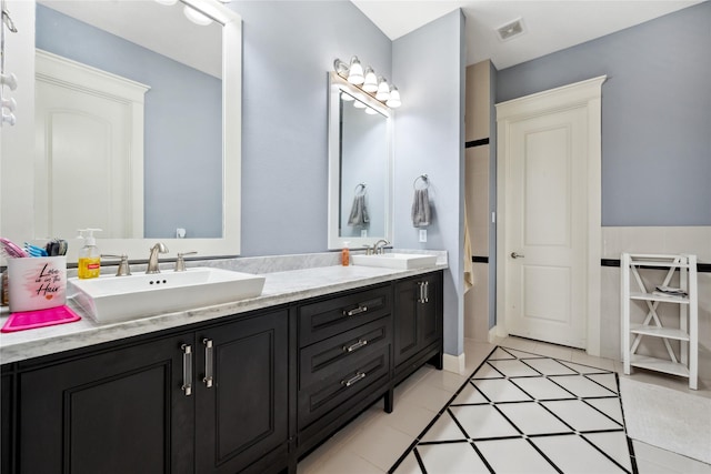 5219 Camp Creek Rd, Baytown, TX 77523 - full bath featuring double vanity and tile patterned floors