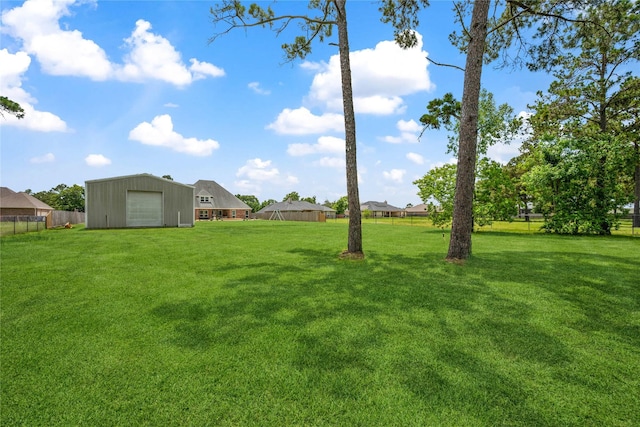 5219 Camp Creek Rd, Baytown, TX 77523 - view of yard with an outdoor structure and an outbuilding