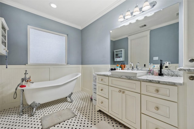 5219 Camp Creek Rd, Baytown, TX 77523 - bathroom with wainscoting, vanity, a freestanding tub, and crown molding