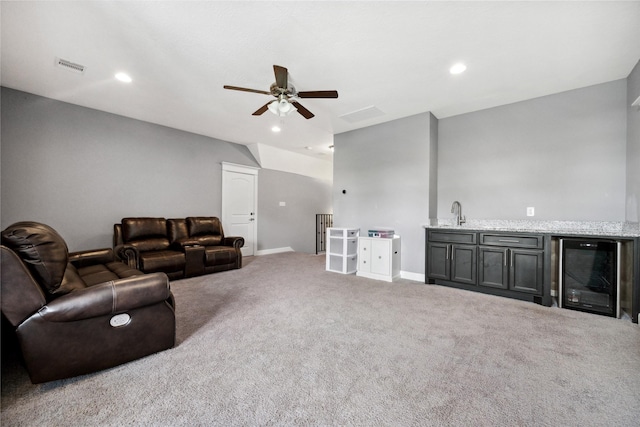 5219 Camp Creek Rd, Baytown, TX 77523 - living room featuring beverage cooler, ceiling fan, carpet floors, recessed lighting, and baseboards