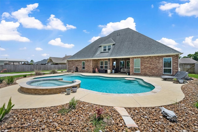 5219 Camp Creek Rd, Baytown, TX 77523 - view of swimming pool with a patio area, a fenced backyard, and a pool with connected hot tub