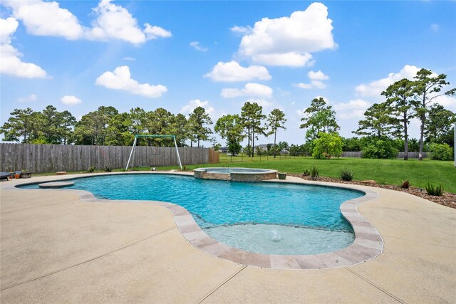 5219 Camp Creek Rd, Baytown, TX 77523 - view of swimming pool featuring a pool with connected hot tub and a patio area