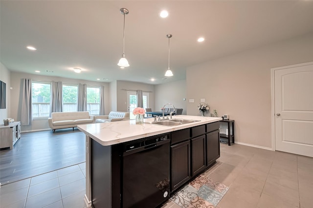 2535 Sandbar Shark Ct, Katy, TX 77449 - kitchen with black dishwasher, a sink, open floor plan, plenty of natural light, and recessed lighting