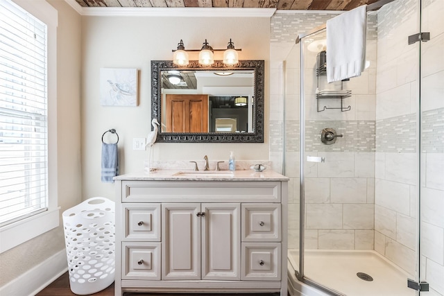 1414 Mechanic St, Galveston, TX 77550 - bathroom with crown molding, a shower stall, vanity, plenty of natural light, and baseboards