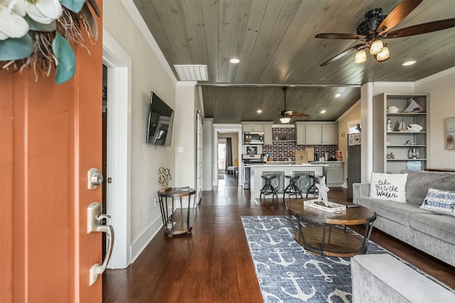 1414 Mechanic St, Galveston, TX 77550 - living room with ceiling fan, wooden ceiling, dark wood-style floors, baseboards, and ornamental molding