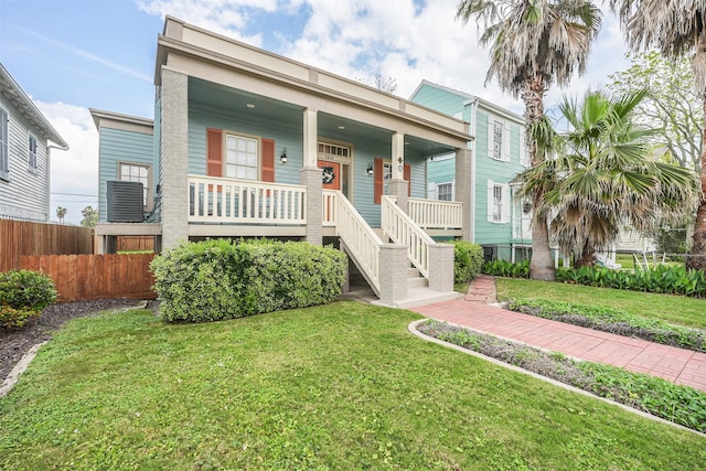 1414 Mechanic St, Galveston, TX 77550 - view of front of property featuring covered porch, central AC, and stairs